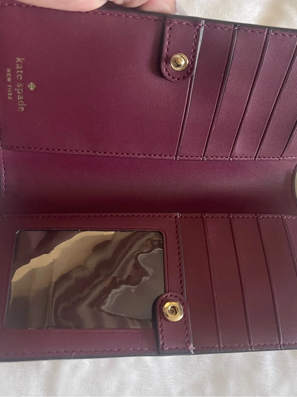 kate spade light pink saffiano leather wallet with gold logo